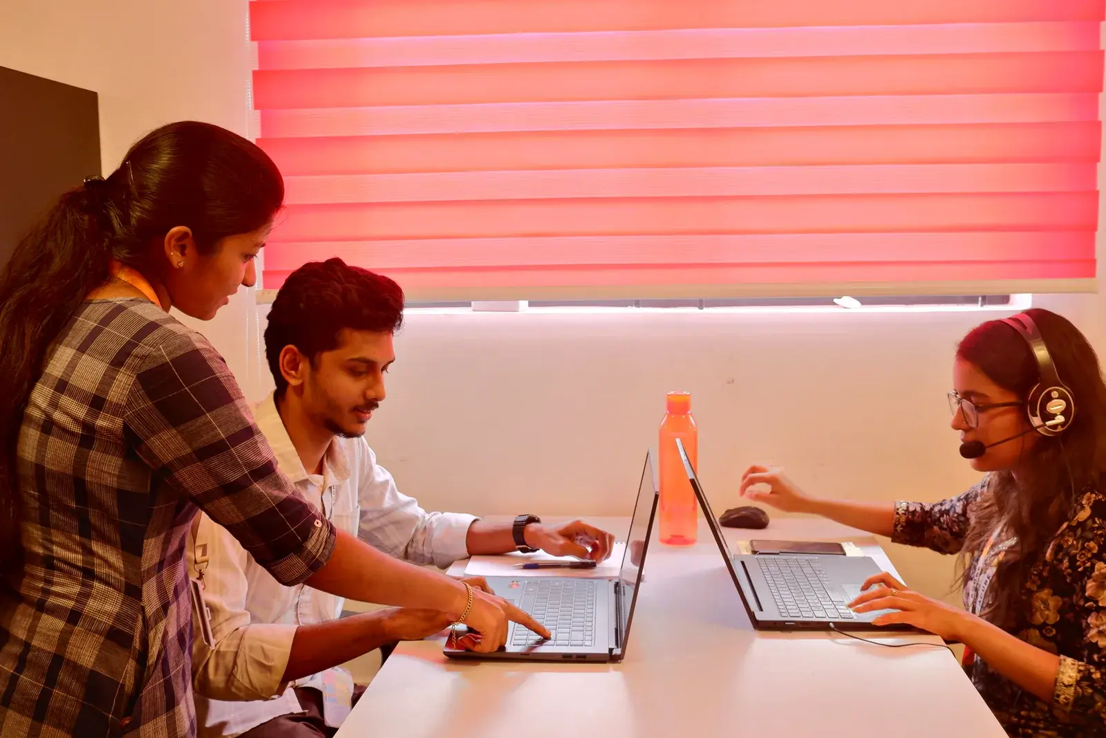 The Acube AI and automation team working through a solution