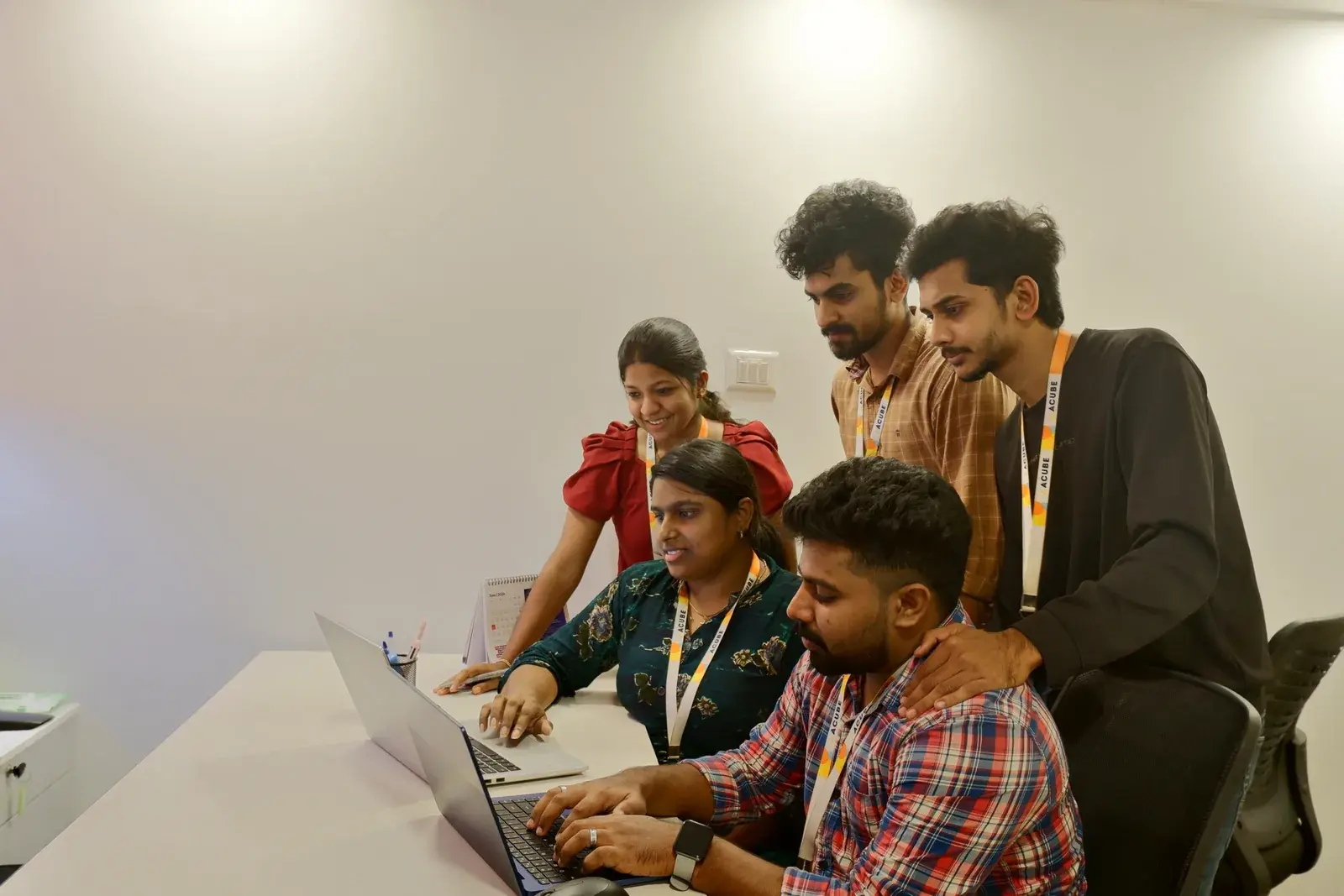 A dedicated Acube development team working together in Kochi