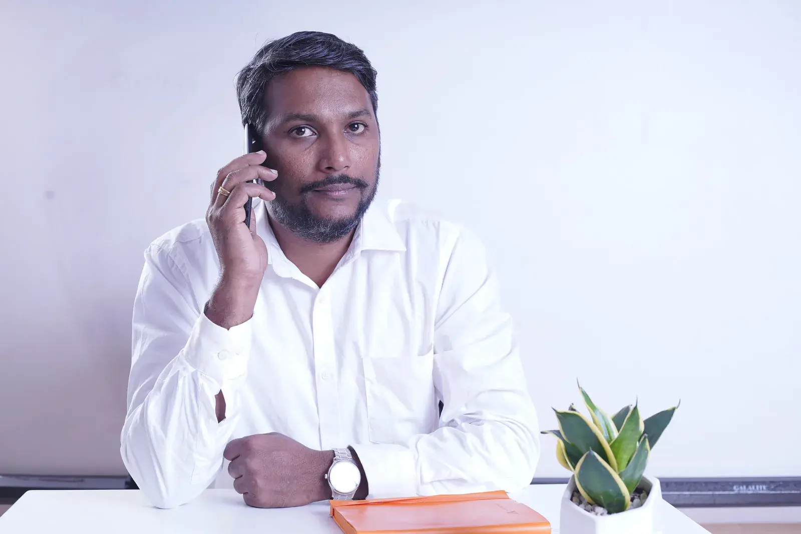 An Acube consultant taking a customer call about ERPNext