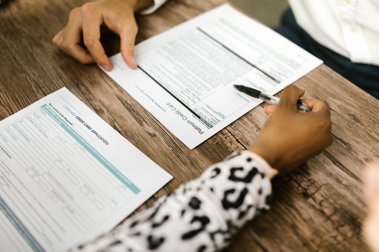 EMI at the counter — and the financier's money reconciled to the rupee — customer signing finance documents store counter, by Acube Innovations, an ERPNext & software development company in India
