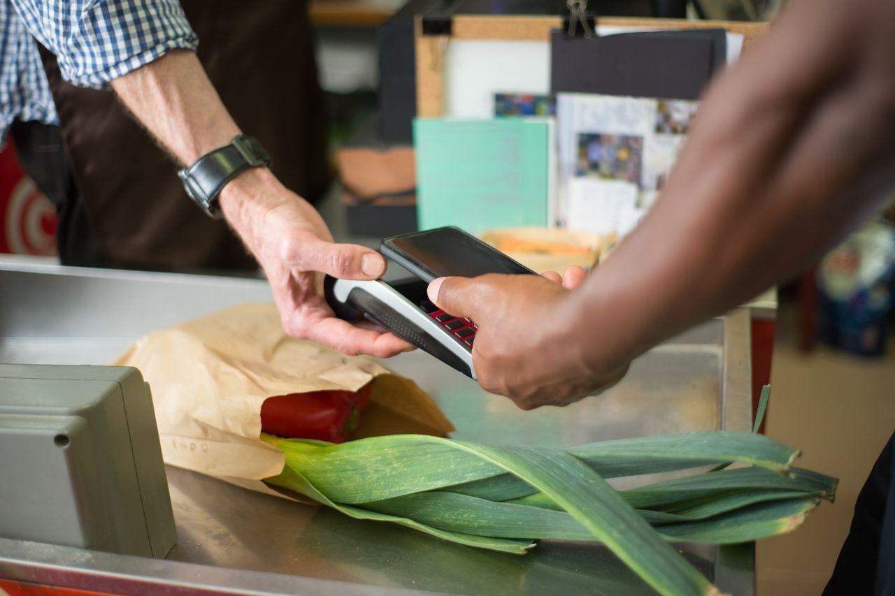 Mobile Service & Retail Store ERP and POS Software — mobile phone store customer buying smartphone india, by Acube Innovations, an ERPNext & software development company in India