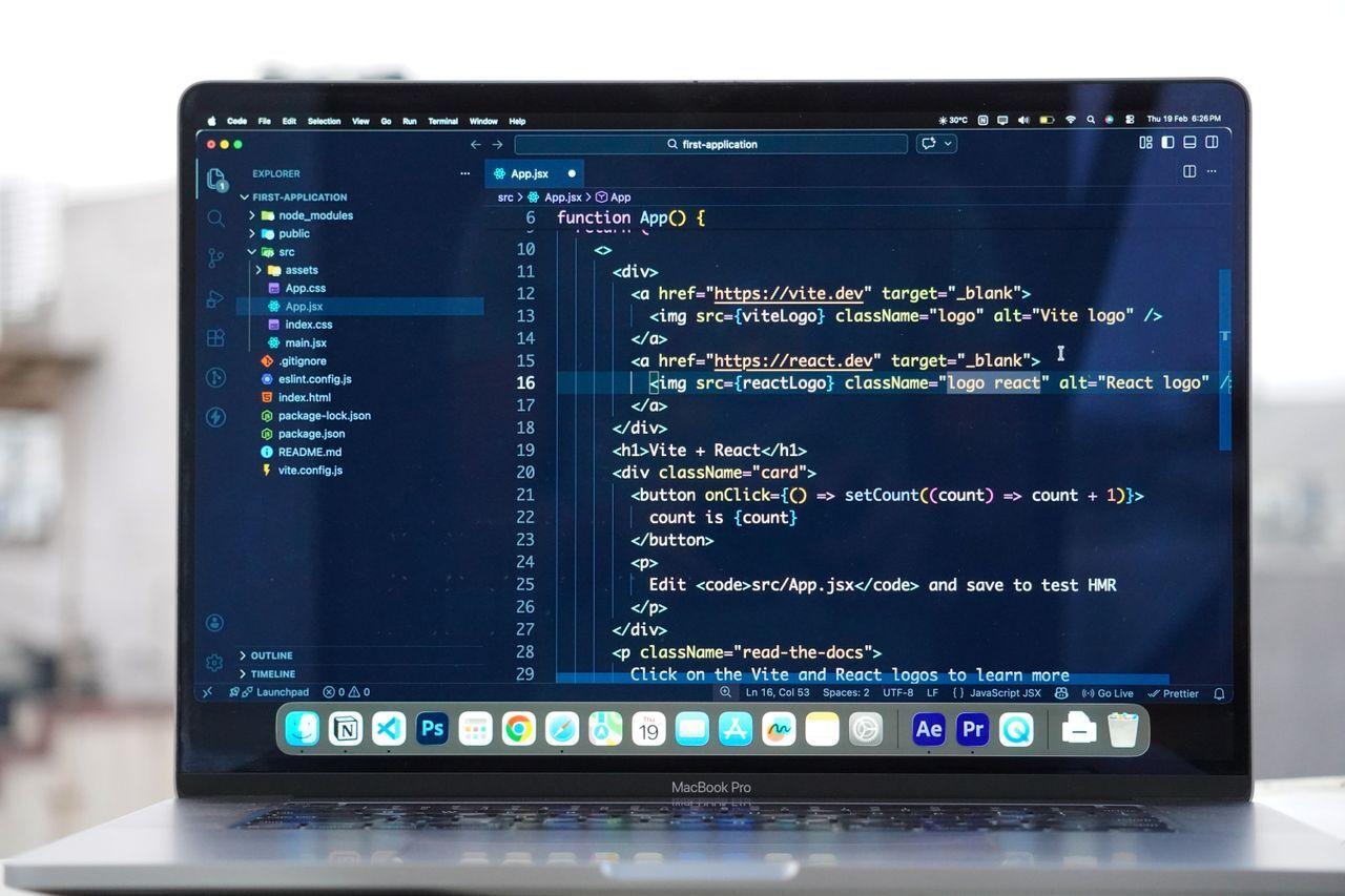 javascript react developer coding laptop — Hire React & Node Developers — Modern Full-Stack JavaScript delivered by Acube Innovations (ERPNext, AI & software, India)