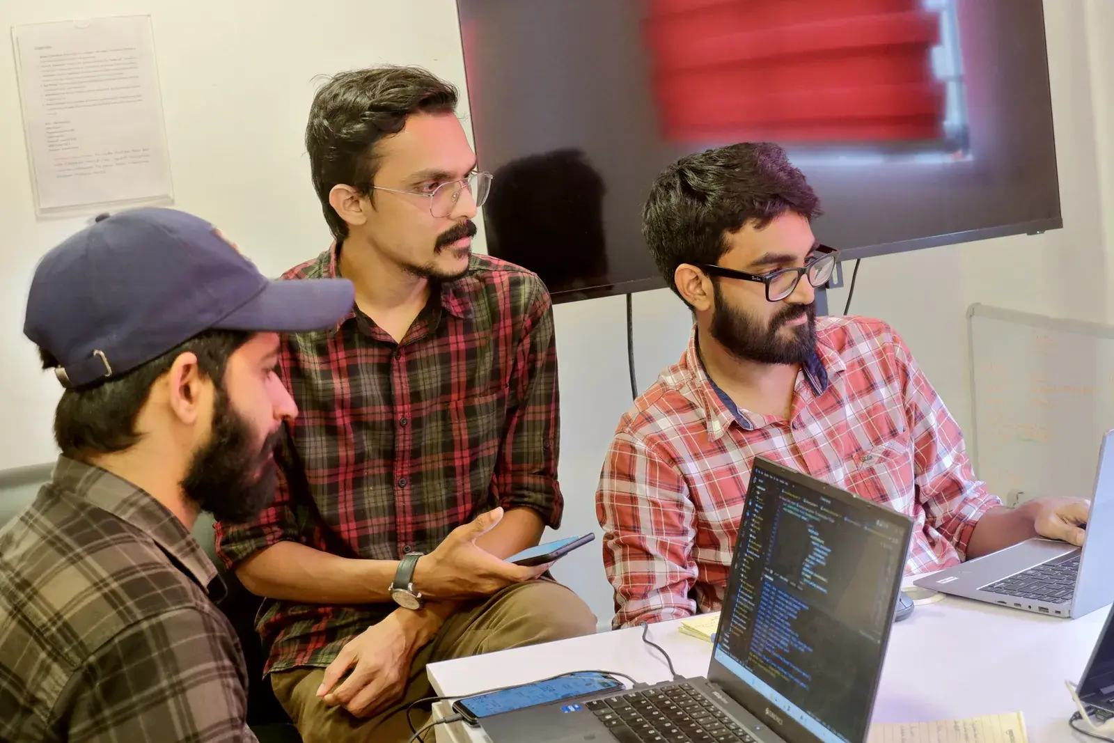 Senior developers at Acube Innovations writing code for an ERPNext rollout