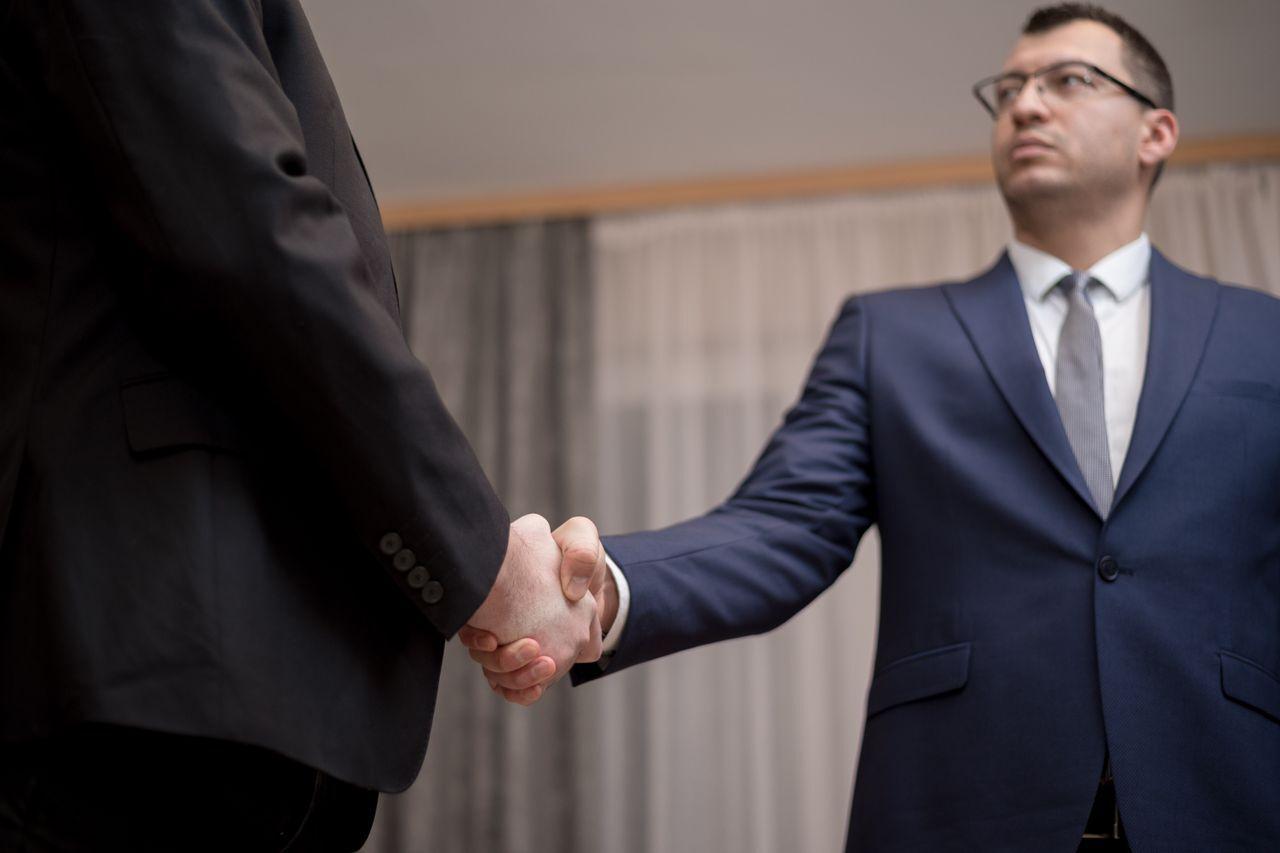 Why Choose Acube Innovations as Your ERPNext Partner — business handshake partnership trust meeting, by Acube Innovations, an ERPNext & software development company in India