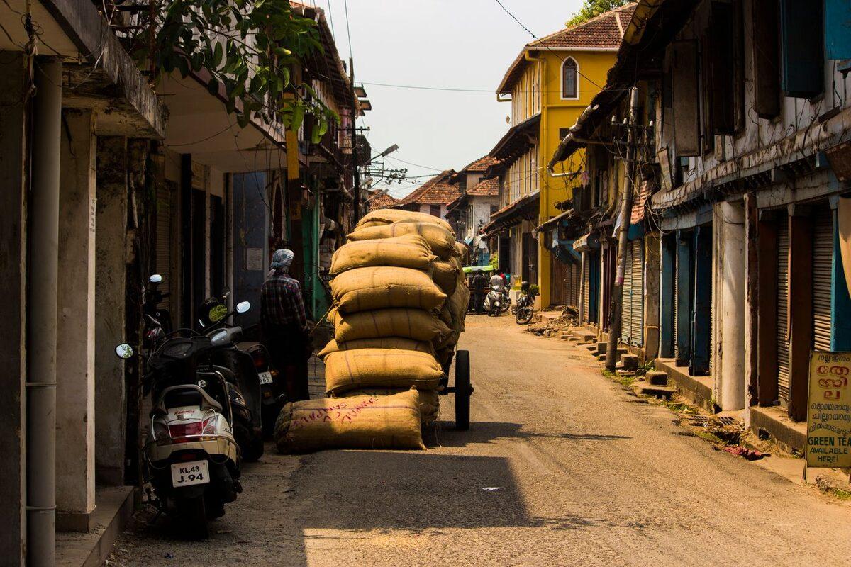 Sacks of spices stacked on a handcart in an old heritage street in Mattancherry, Kochi