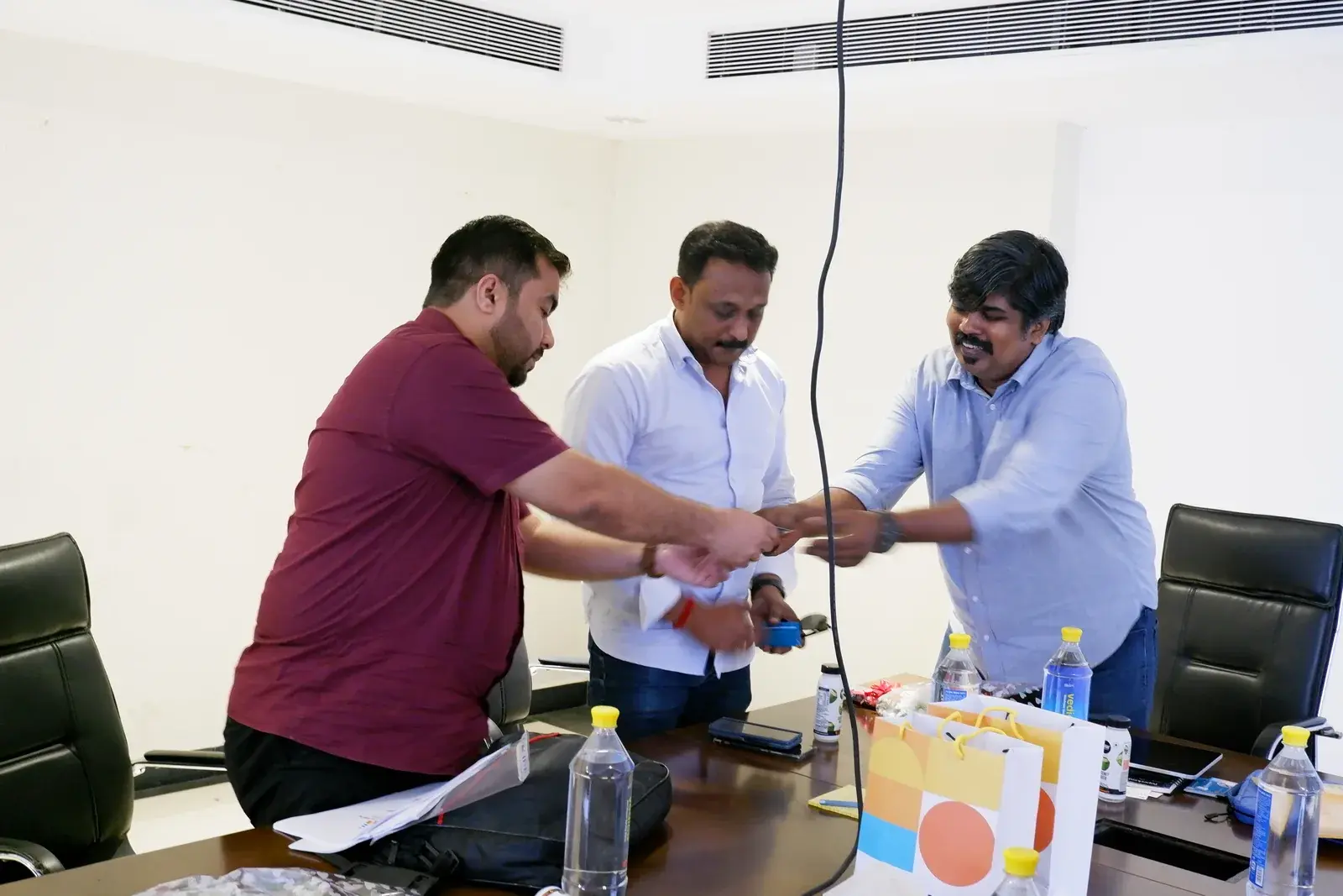 Acube and a client team sealing a successful ERP engagement