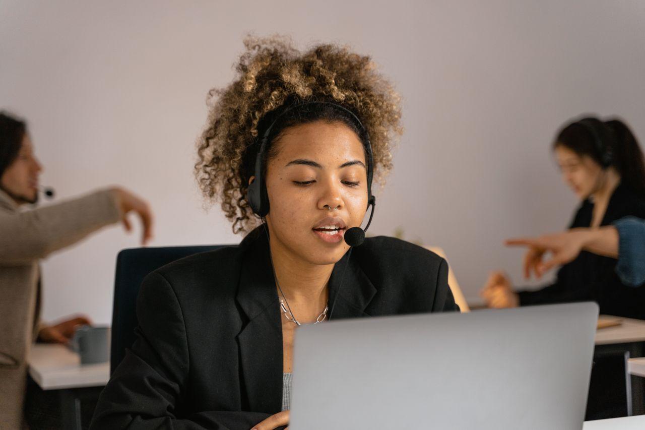 customer support agent laptop headset office — AI Chatbots That Answer, Qualify & Sell 24/7 delivered by Acube Innovations (ERPNext, AI & software, India)