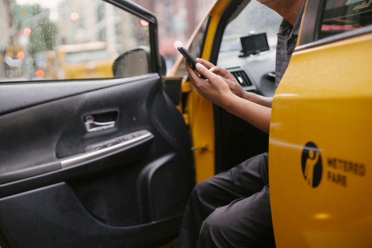 Kera Cabs — 55% of Bookings Moved Off the Phone and Into the App — taxi driver smartphone app city street, by Acube Innovations, an ERPNext & software development company in India