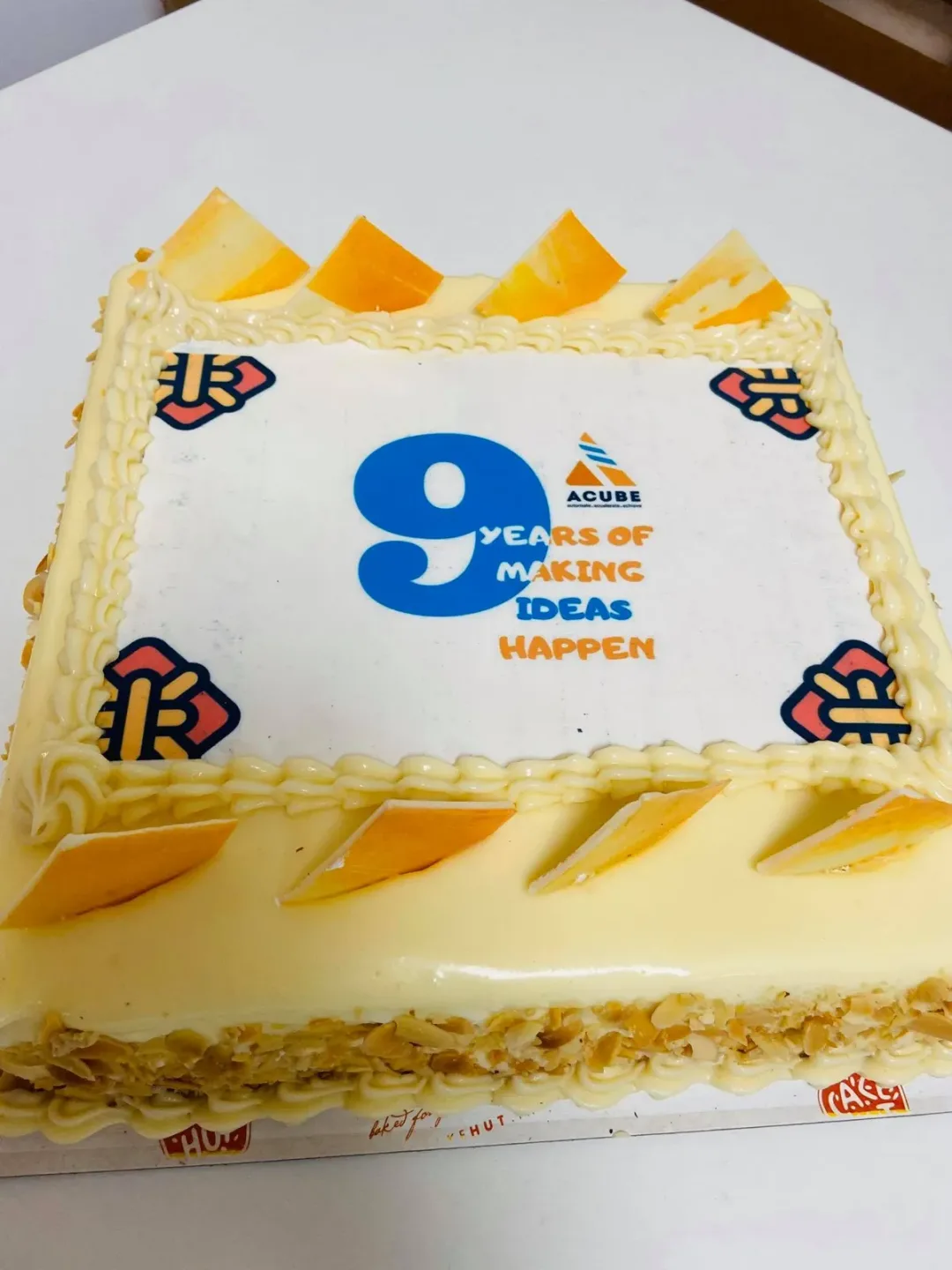 An anniversary cake with a large number nine on top