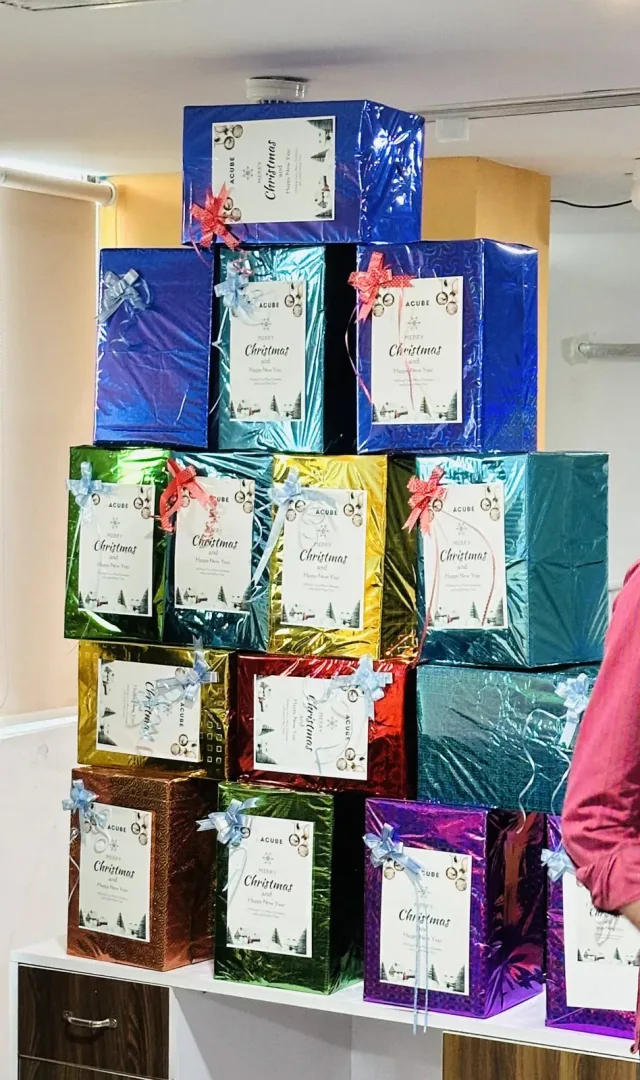 Christmas gift boxes stacked for the team