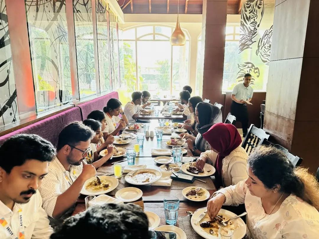 A long table of colleagues at the anniversary lunch