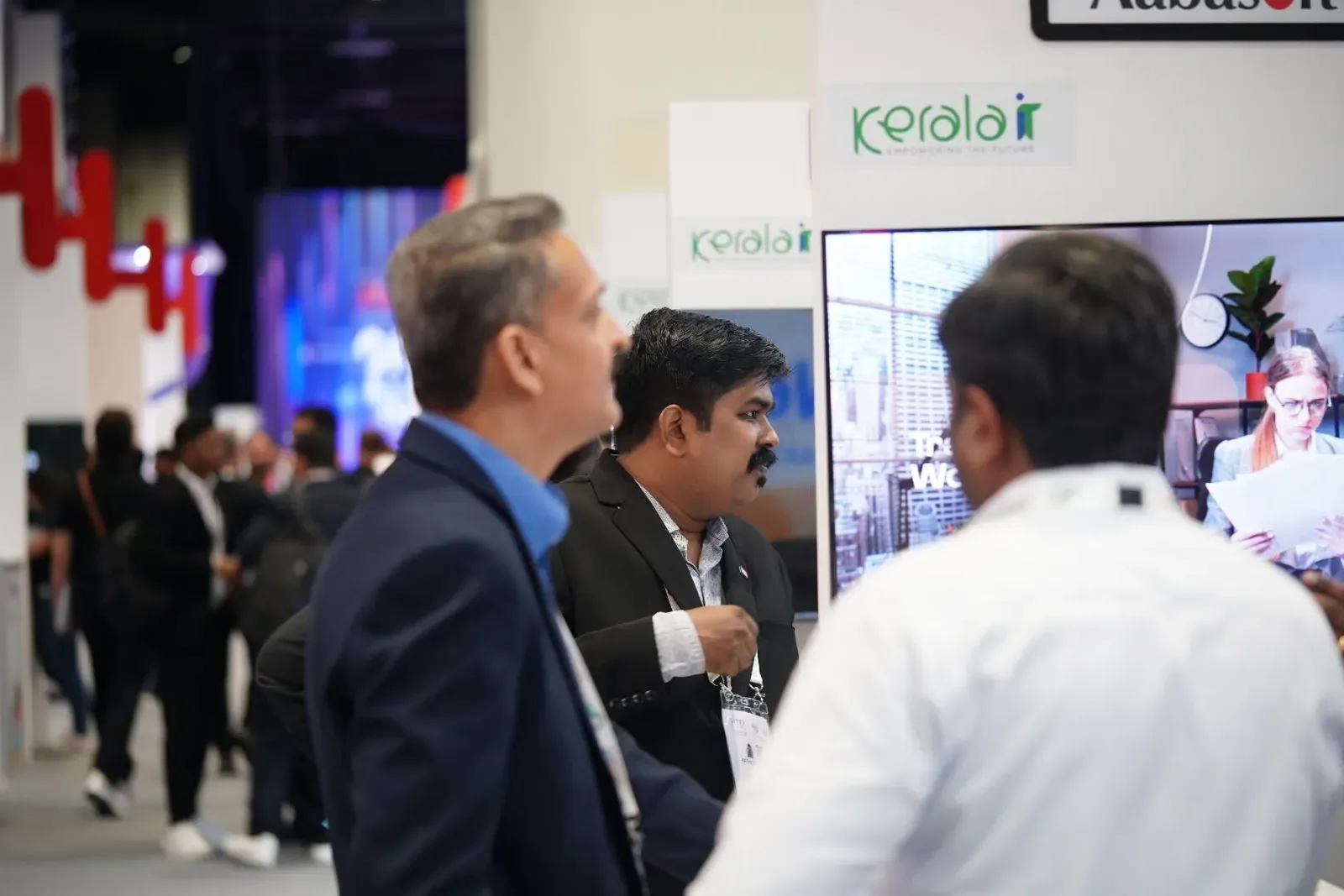 Visitors in conversation at the stand
