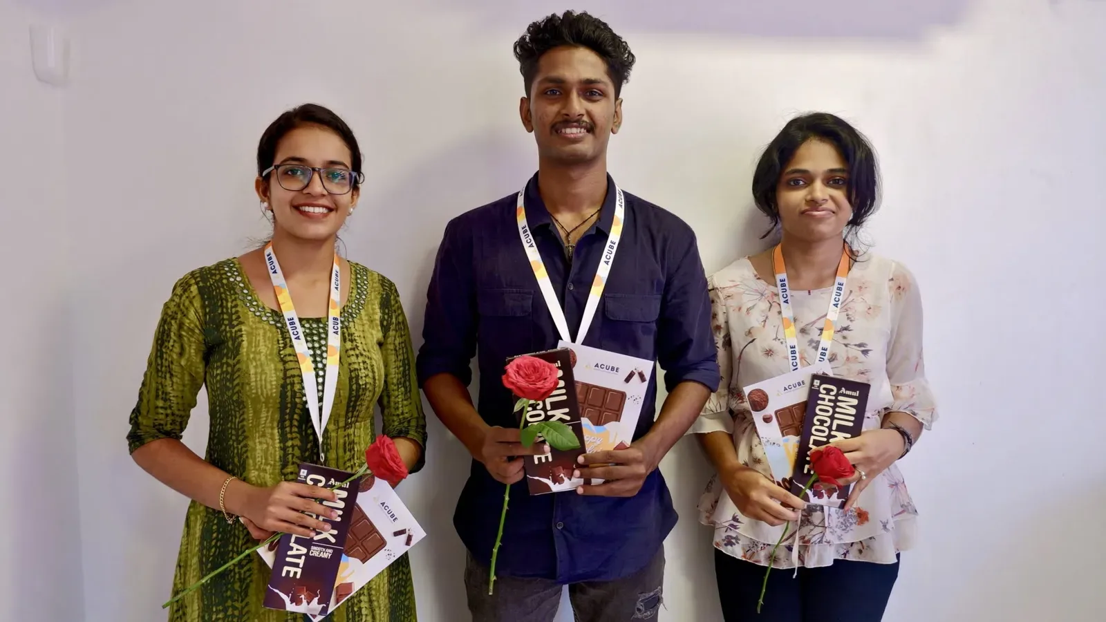 Three colleagues with roses