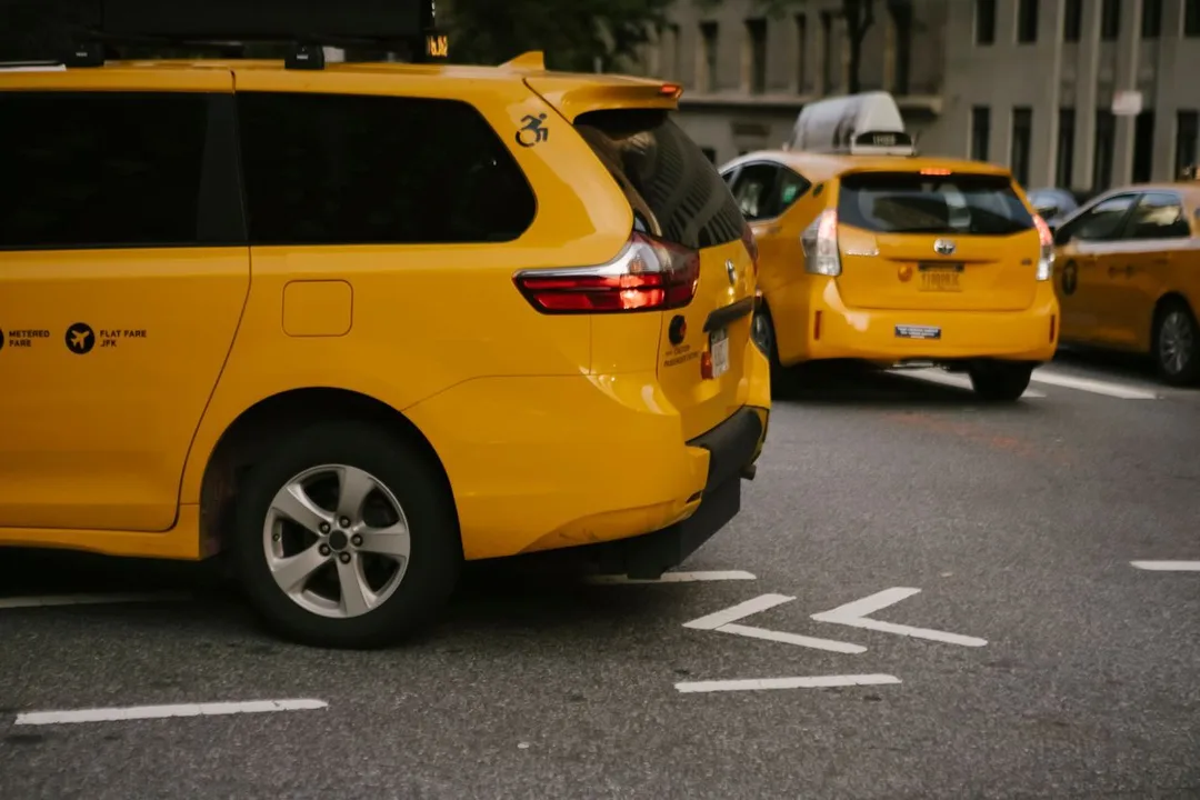 Taxi & Cab Company Management ERP Software — taxi cab fleet city street, by Acube Innovations, an ERPNext & software development company in India